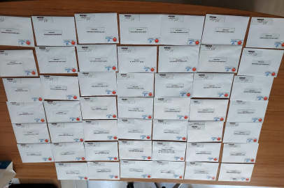 Şehitlerin isimlerinin yazılı notla yetimlere gıda çeki dağıtıldı