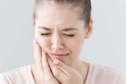 Baş ağrınızın kaynağı gömülü yirmilik dişleriniz olabilir