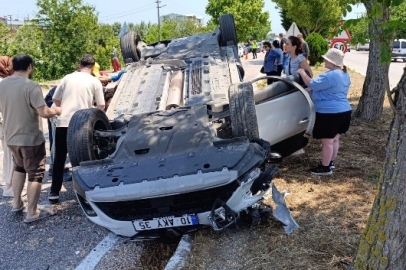 Balıkesir'de ters dönen araçta sıkışan sürücüyü itfaiye kurtardı