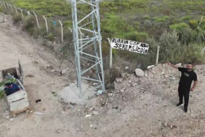 Evinin yanındaki araziye "Buraya çöp atan şerefsizdir" yazısı astı