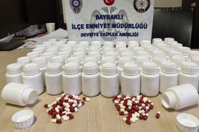 İzmir'de mezarlıkta poşet içerisinden binlerce uyuşturucu hap çıktı