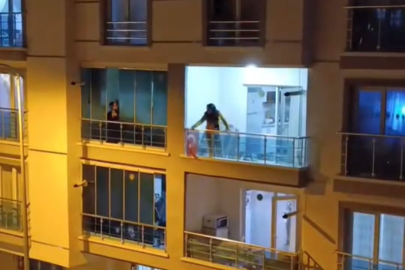 Sinir krizi geçiren genç kadın balkonundaki eşyaları yola fırlattı