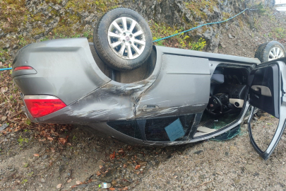 Takla atan otomobilden yara almadan kurtuldu