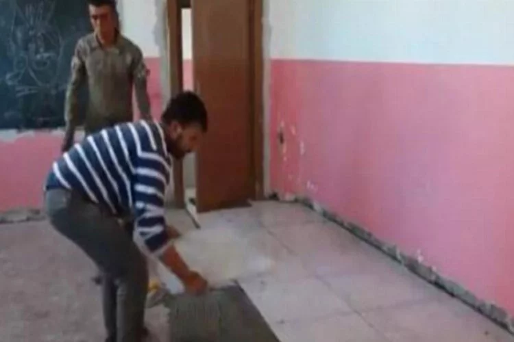 Hainlerin tahrip ettiği okulu Mehmetçik onarıyor