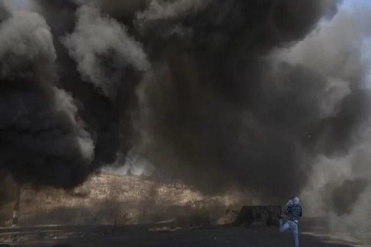 İsrail, Gazze'nin bombalandığı fotoğrafı Kur'an'dan sureyle paylaştı
